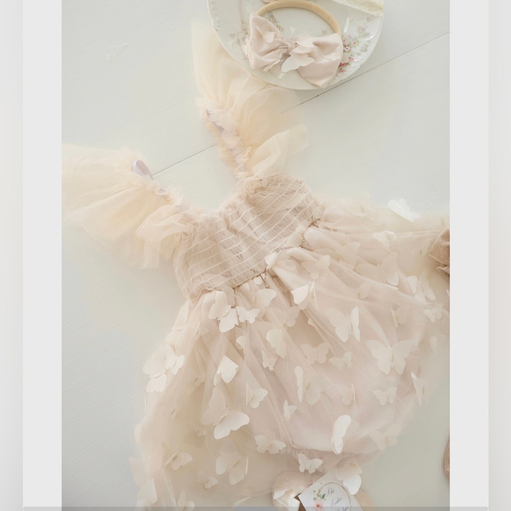 3M milestone dress with bow.